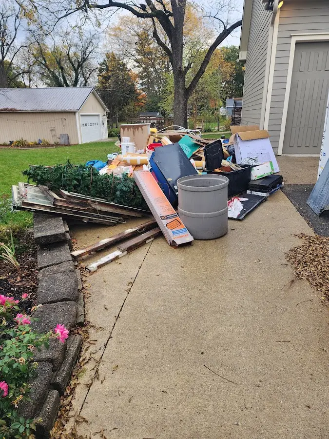 Dumpster being loaded with debris for Commercial Dumpster Rental in Yorba Linda
